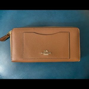 3 accordion style Coach wallets..